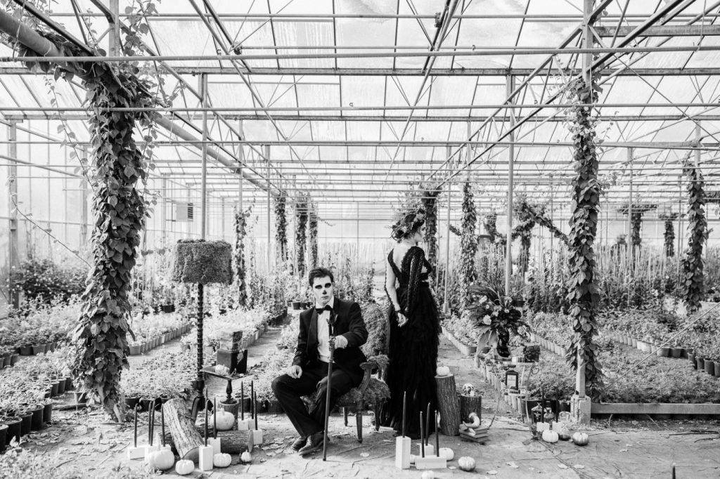  Halloween wedding inspiration with a bride and groom dressed in black dress in the greenhouse in Greece 