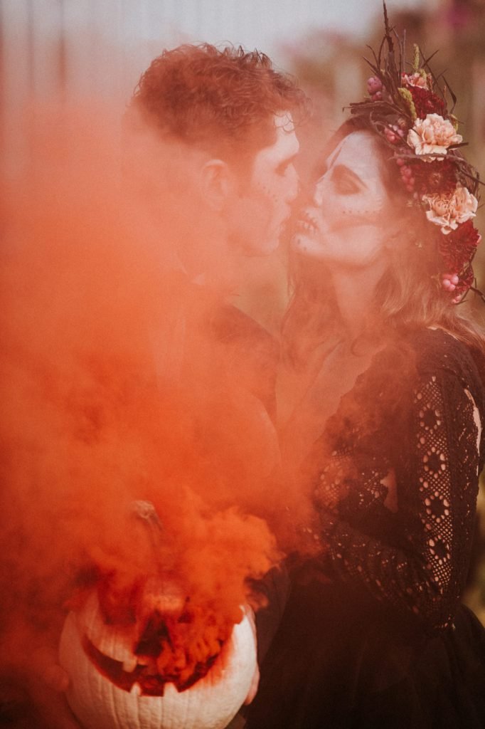 red smoke Halloween Wedding inspiration couple in the clouds