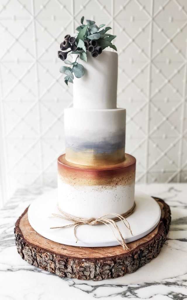Faye Cahill Cake Trends White blue and gold