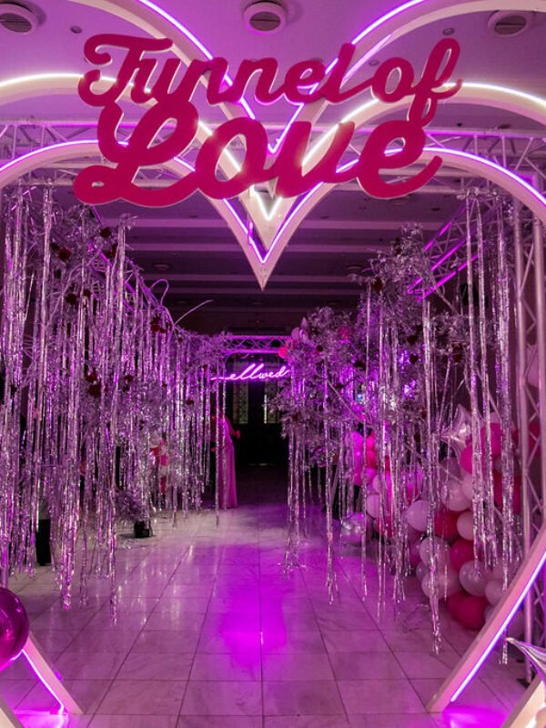 Neon heart arch wedding party