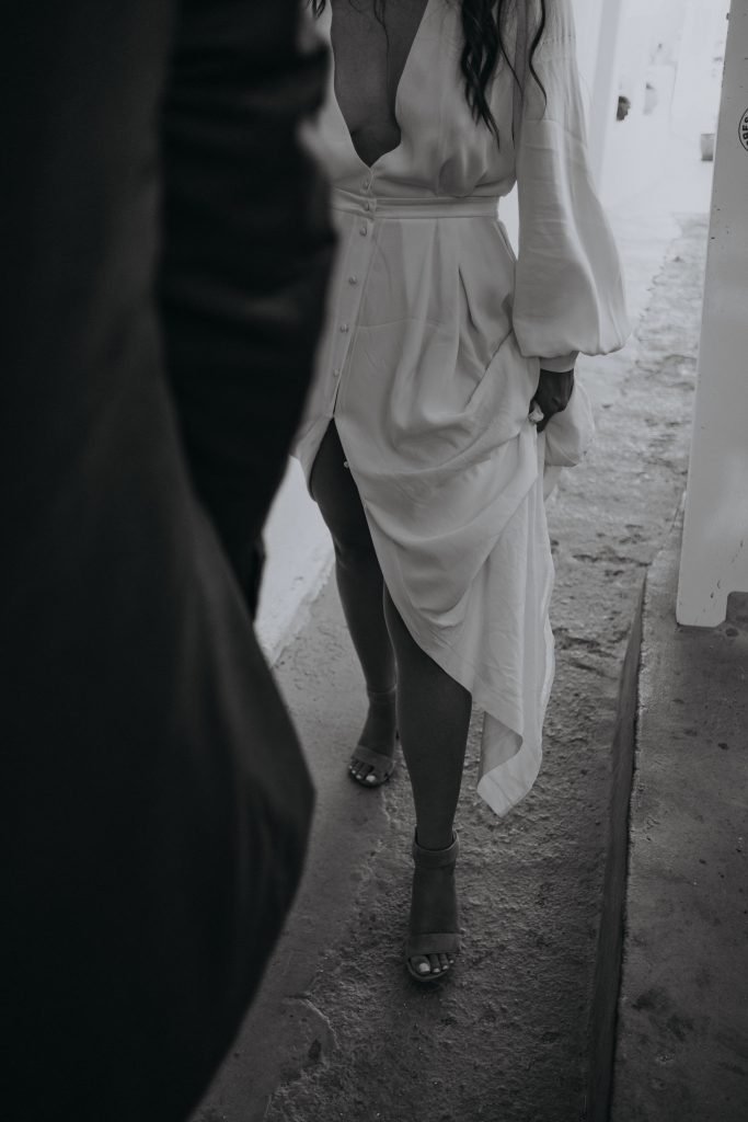 stylish Santorini elopement couple walking