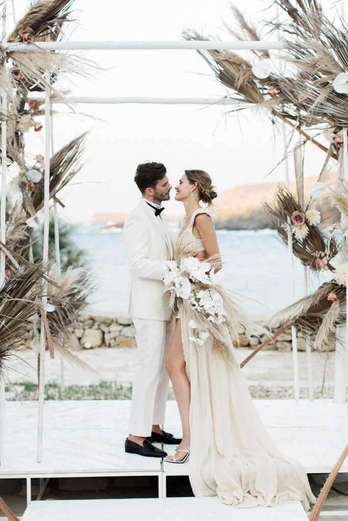 Love Story in Mykonos Bride and Groom Getting Married in Greece under the Boho Chuppah