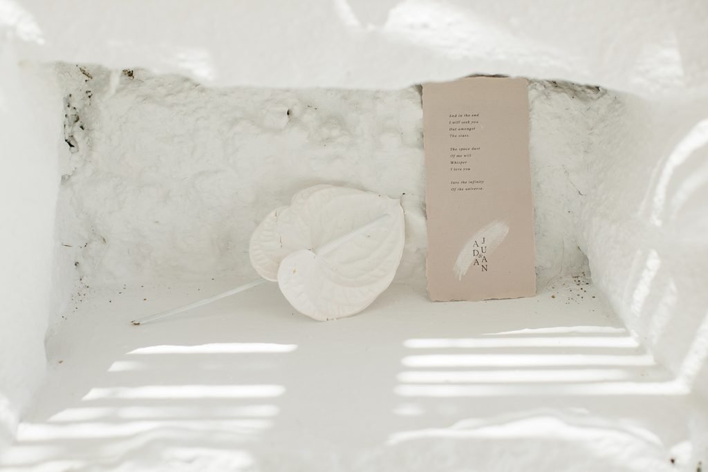 Love Story in Mykonos stationery flatlay in a cave