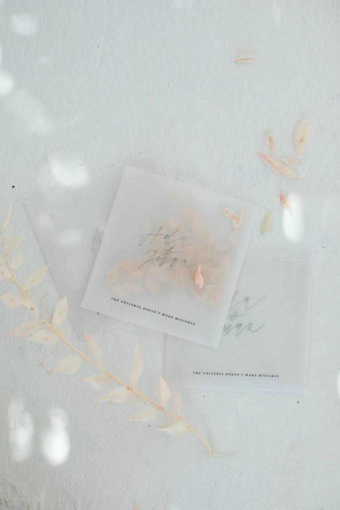 Love Story in Mykonos stationery flatlay throwing confetti