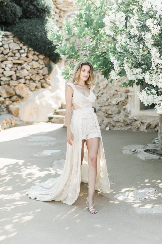 Bride walking down the aisle in the villa in shorts Love Story in Mykonos 