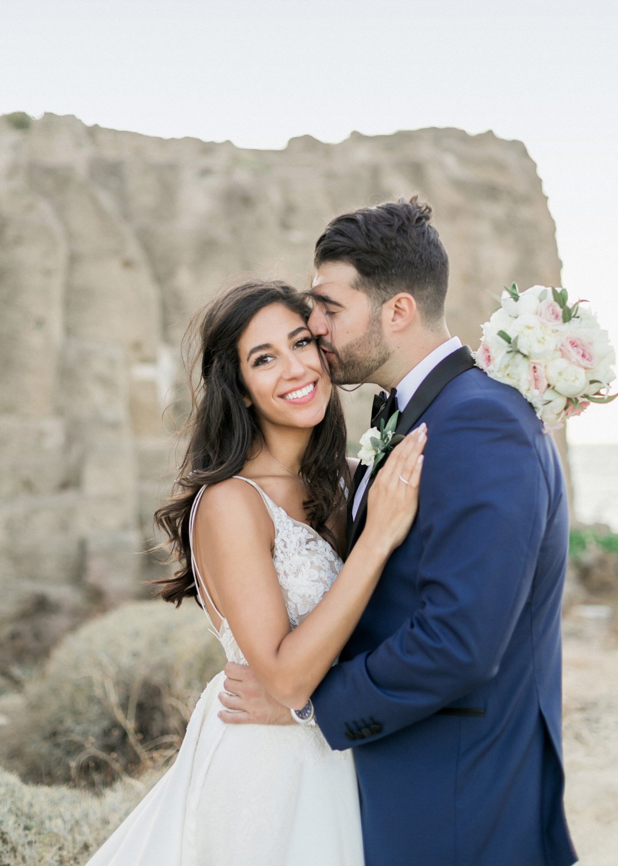 Bride and Groom hugging real bride