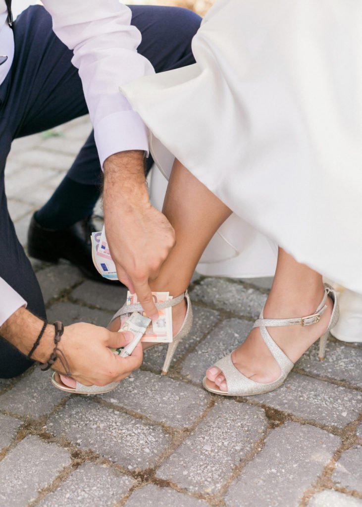 Money stuffing in brides shoes as a tradition