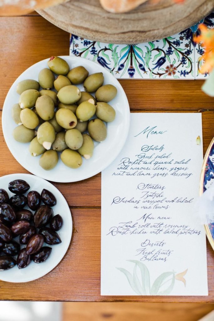 Greek olives and menu for the Welcome Dinner Inspiration