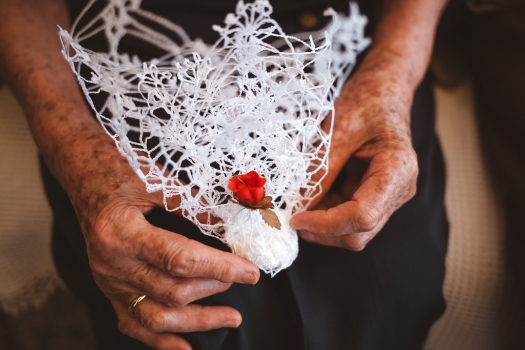 Grandmother holding a handmade crochet