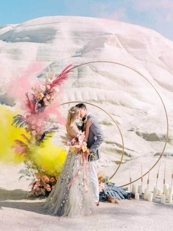 Couple Kissing in front of the Lunar arch for Elopement Cover Shoot