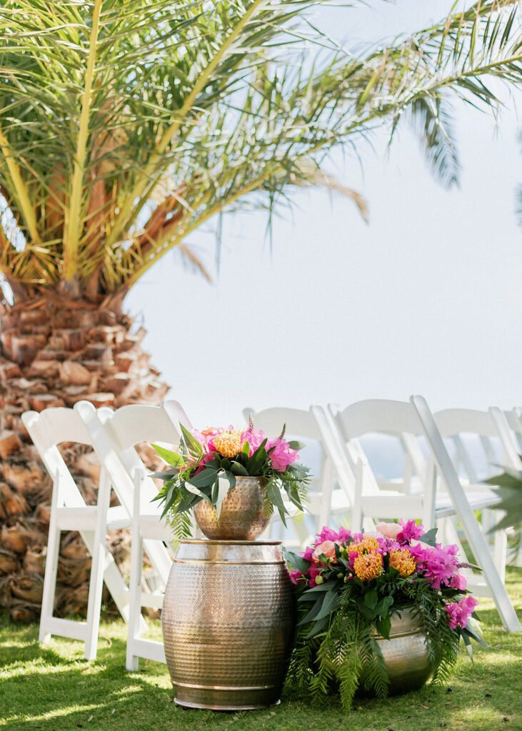 chairs at he ceremony overlooking the sea at the Fun and colorful modern island wedding