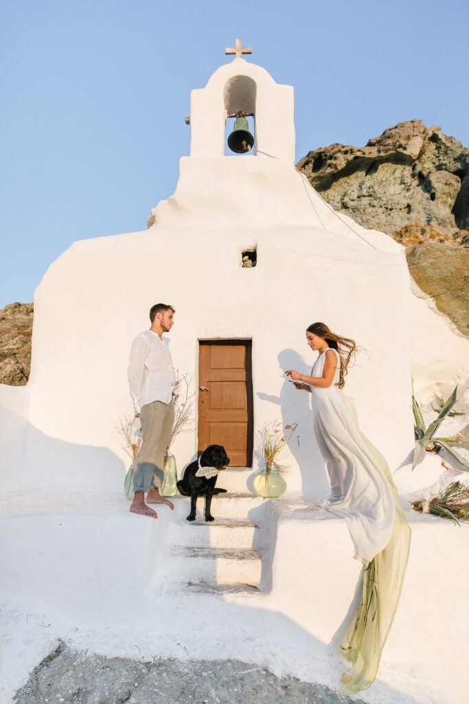 Natural Minimalist Elopement on the island of Naxos couple and the dog at the church