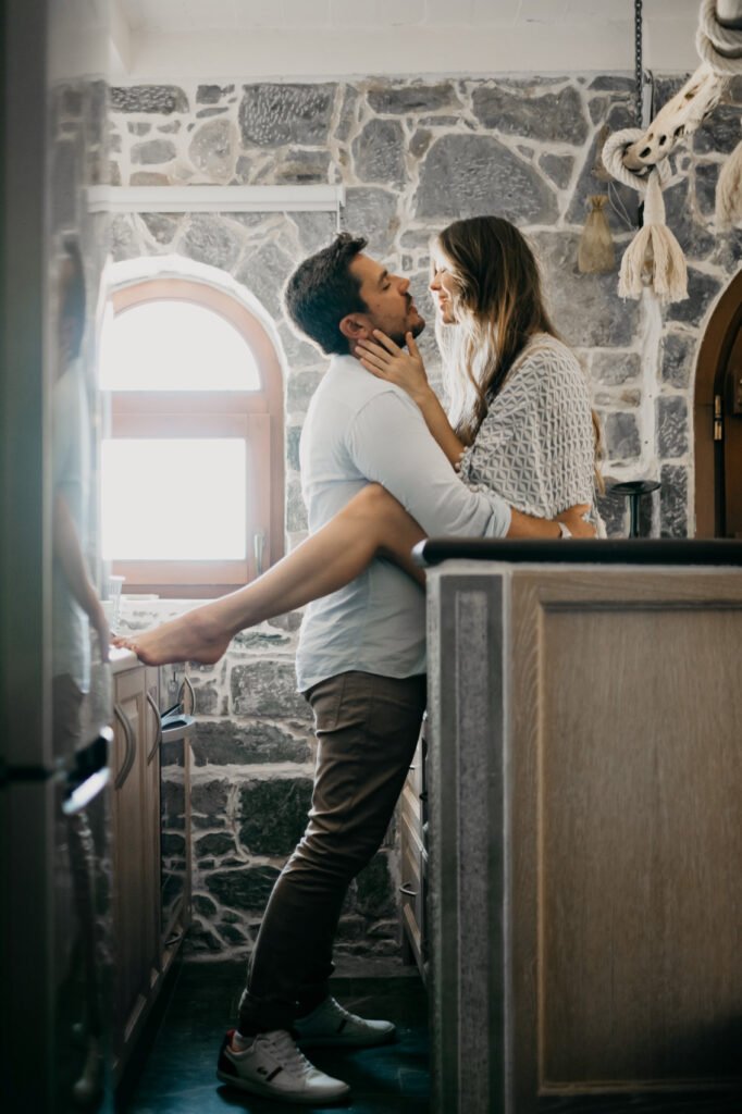Couple kissing in the kitchen