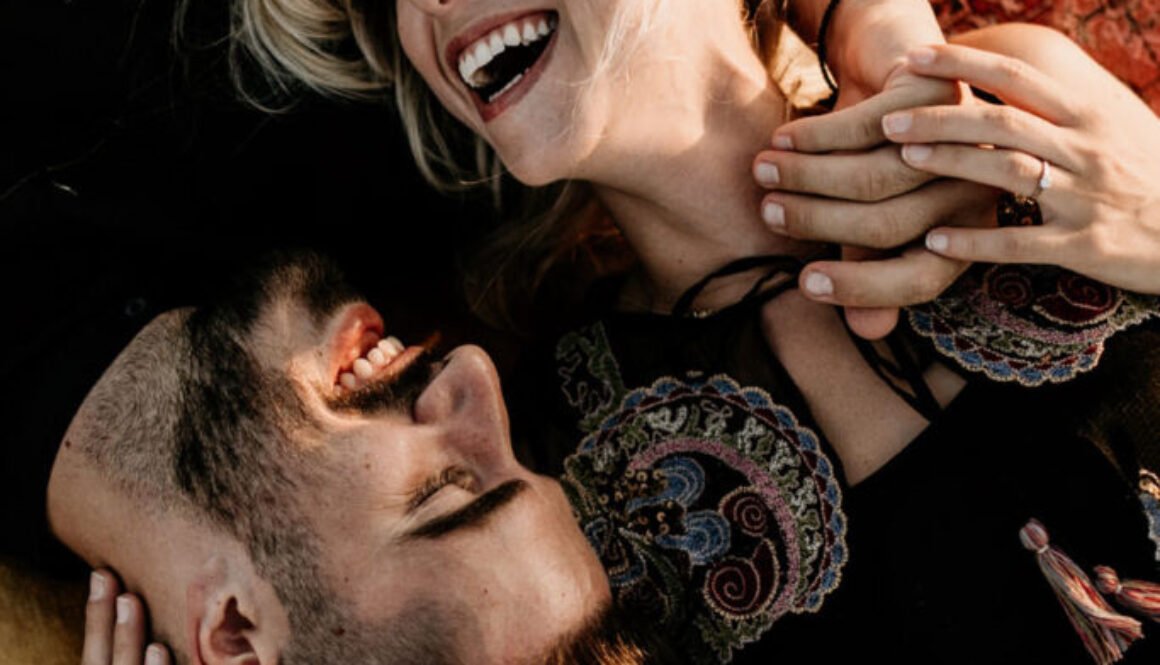 Couple Laughing while Drunk in Love Under the Empty Skies