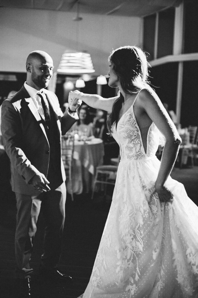 Bride and Groom dancing in black and white