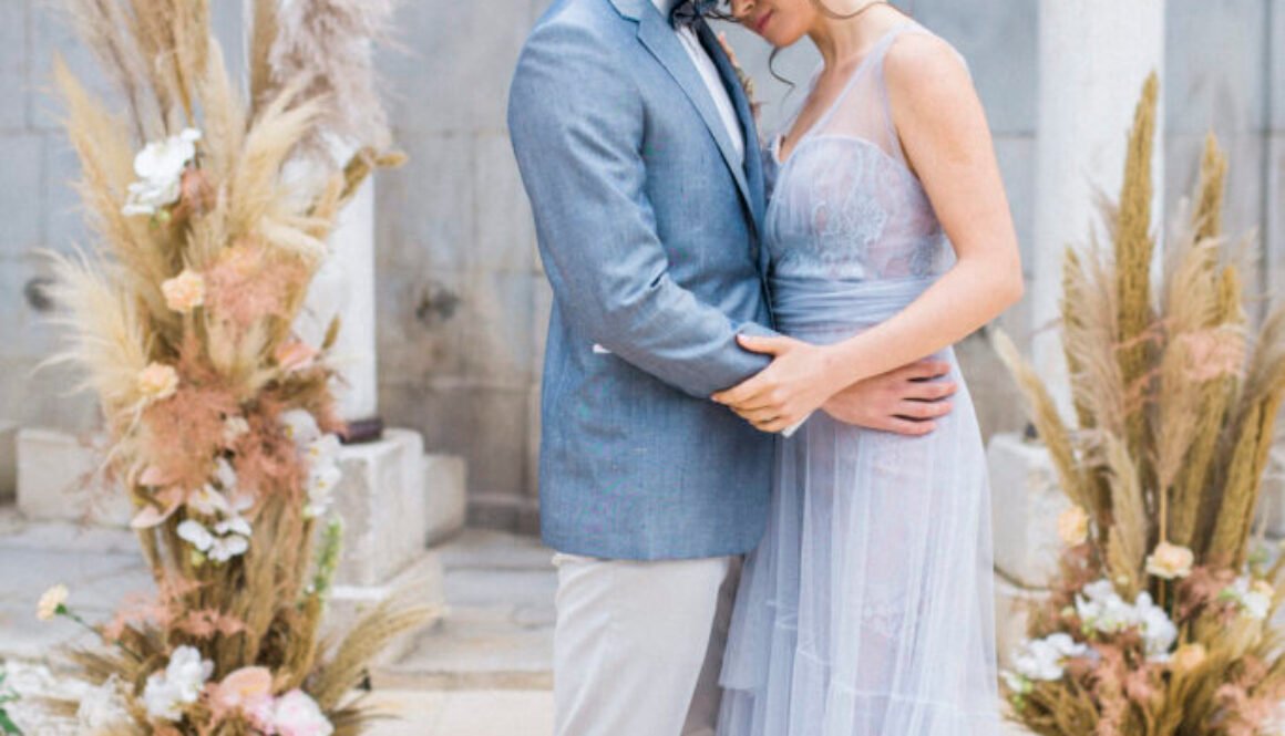 Luxury Elopement couple getting married in Kavala hotel with pampas grass