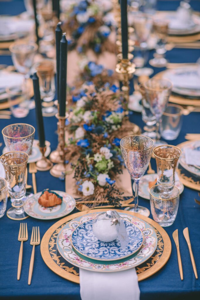 Magical Destination Christmas Wedding Table setup in gold and blue