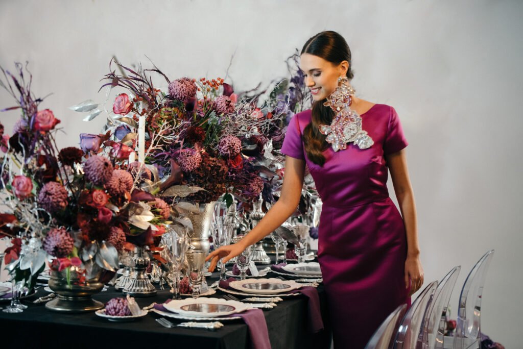 Majestic Christmas Feast girl in purple dress setting the table