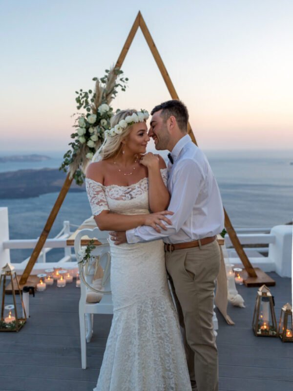 Dreamy Budget Elopement Santorini couple posing at sunset