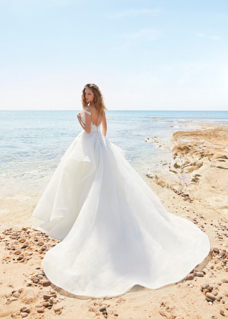Bride with a big dress on the beach