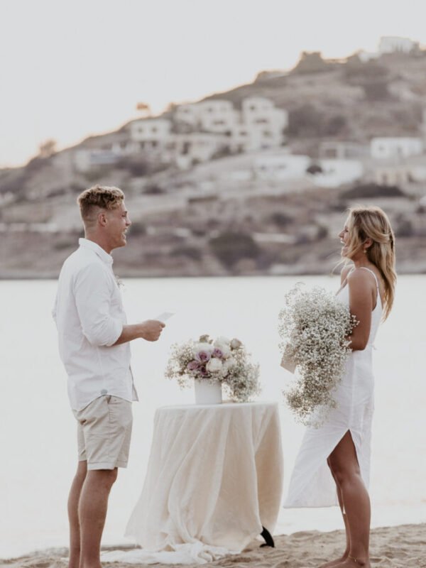 Romantically Simple Elopement Inspiration couple getting married on the beach
