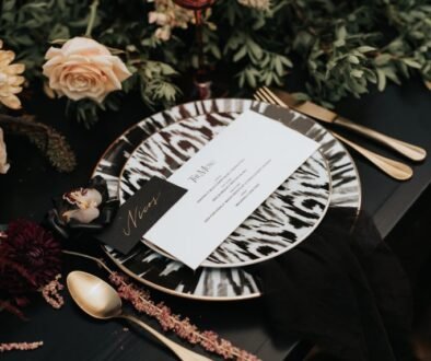 Bohemian Rhapsody Bridal Inspiration table setup with black and white animal pattern plates romantic wedding reception ideas