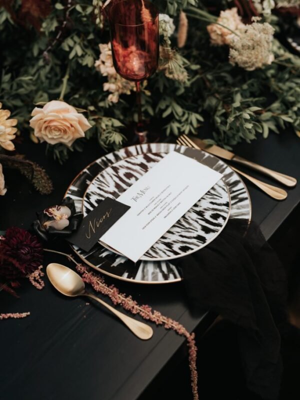 Bohemian Rhapsody Bridal Inspiration table setup with black and white animal pattern plates romantic wedding reception ideas