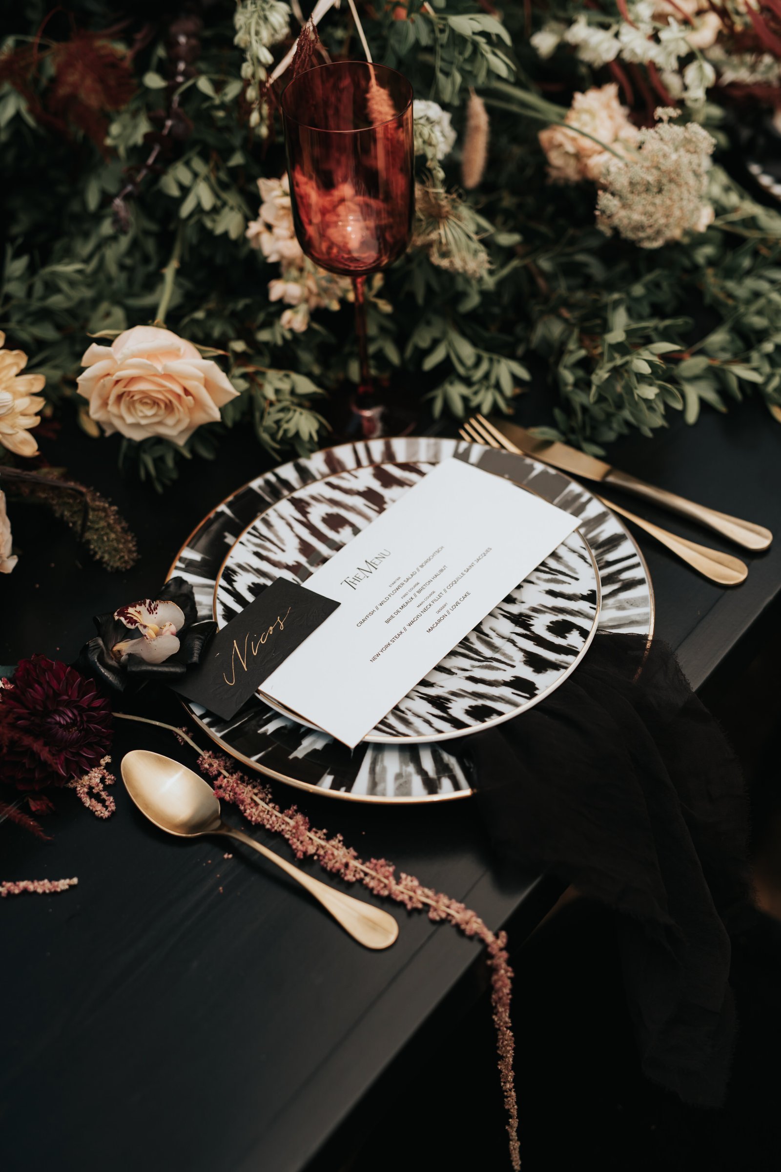 Bohemian Rhapsody Bridal Inspiration table setup with black and white animal pattern plates