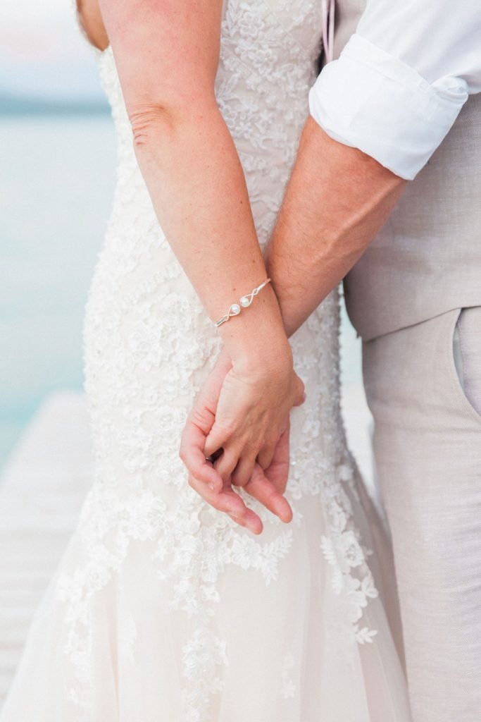 Holding hands at Romantic Greek Island Destination Wedding