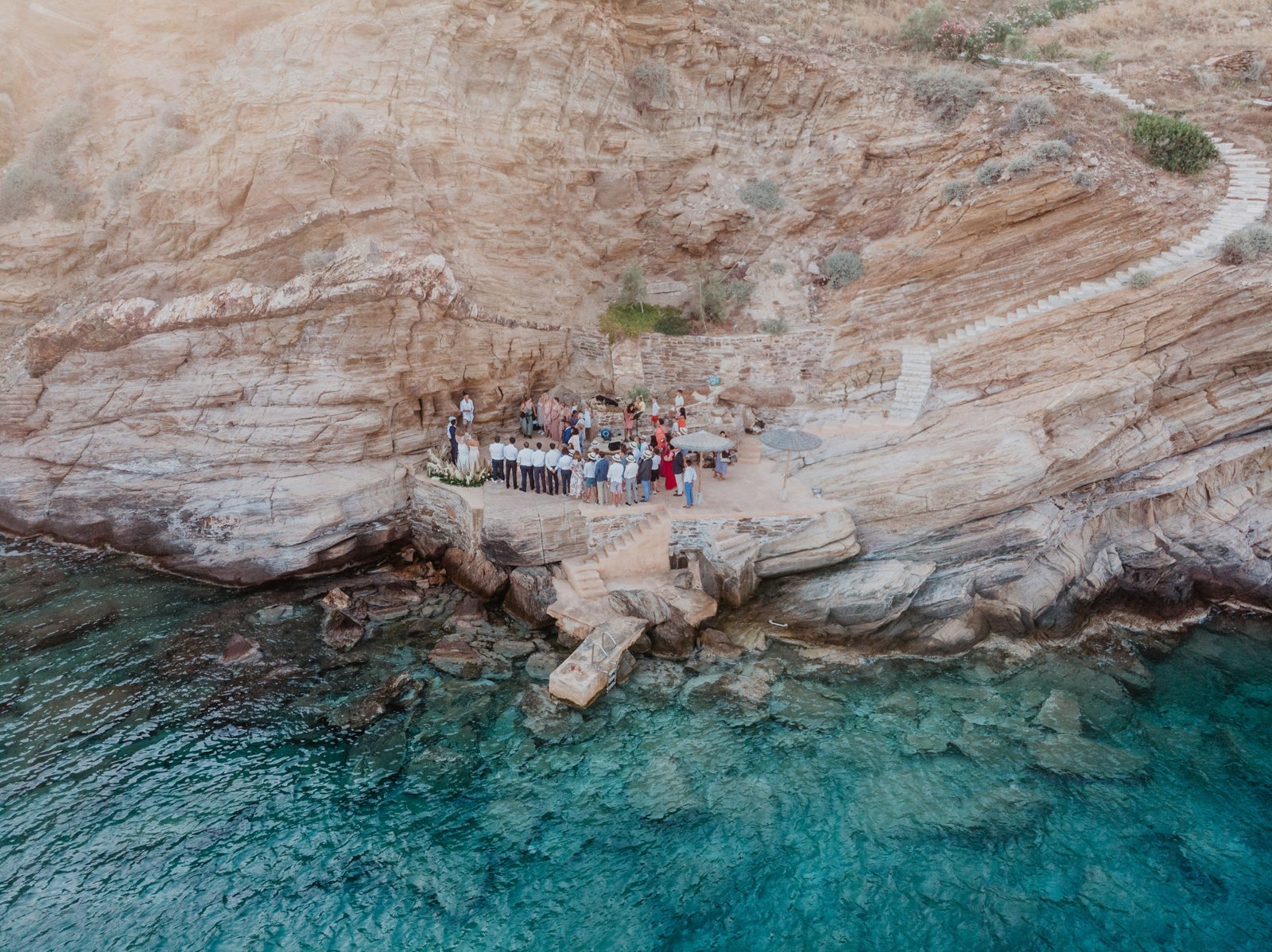 Wedding ceremony on the rocks with guests from around the world
