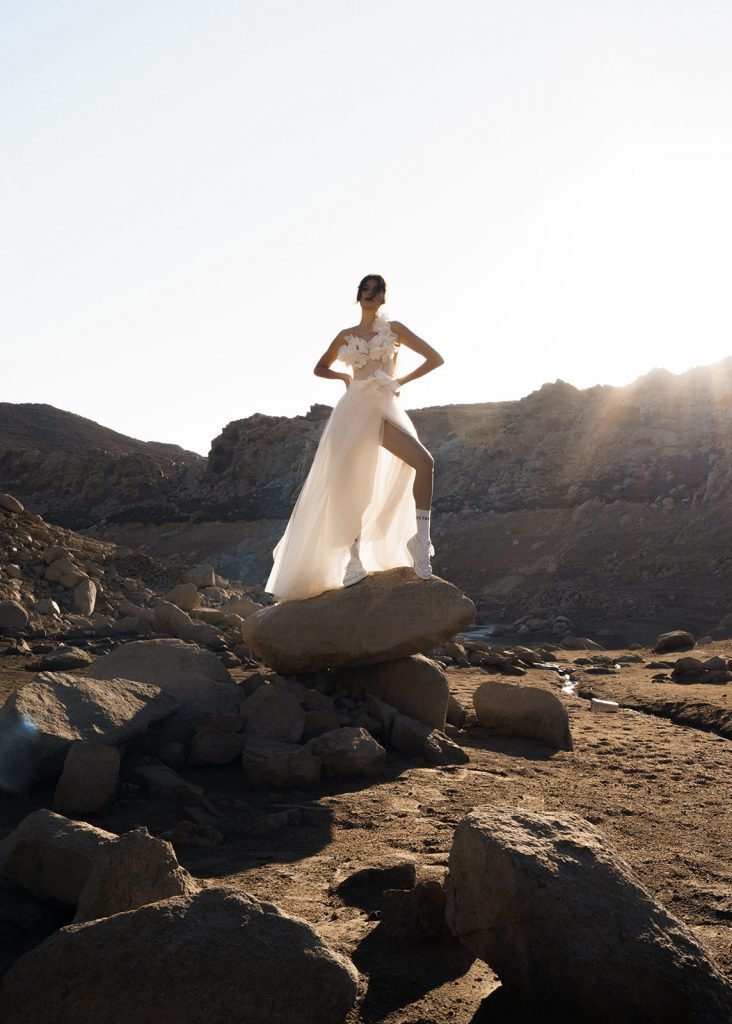 Bride standing on the rock in Mykonos