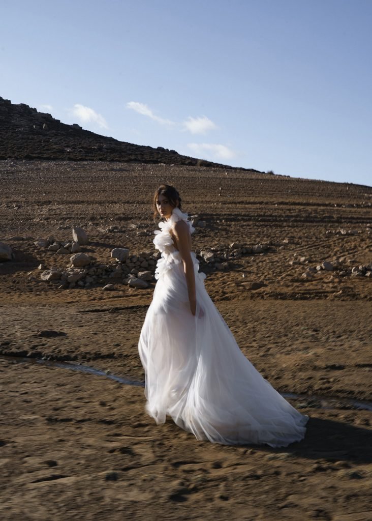 Bride walking in the Mars like landscape in Mykonos