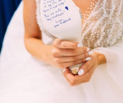 Bride writing on her bridal shoe