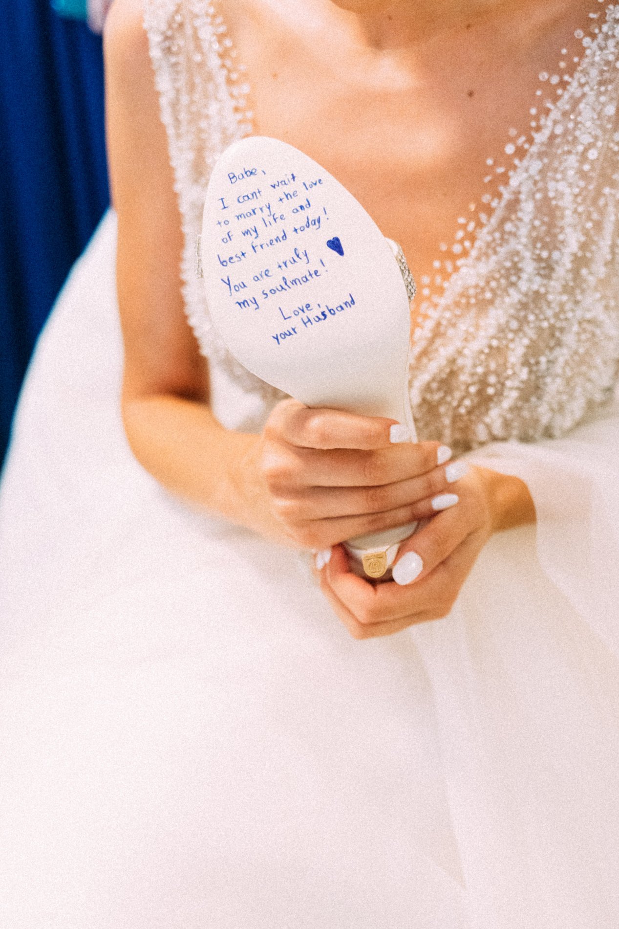 Bride writing on her bridal shoe Greek Wedding Traditions