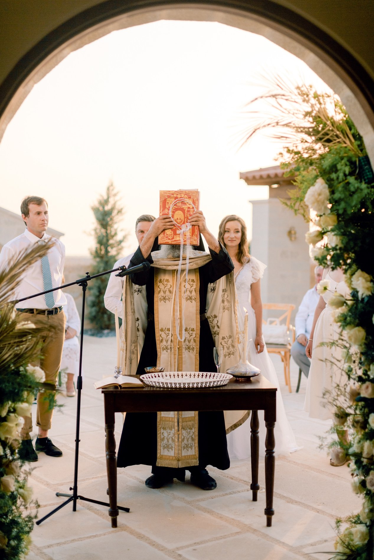 Greek Orthodox priest performing the ceremony at the church