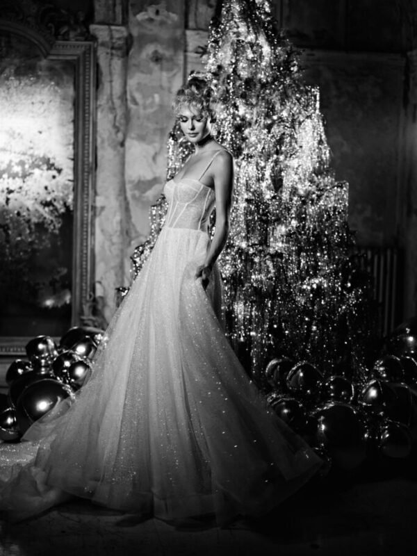 19 Christmas Wedding Ideas from Ellwed Bide Infront of the Christmas tree