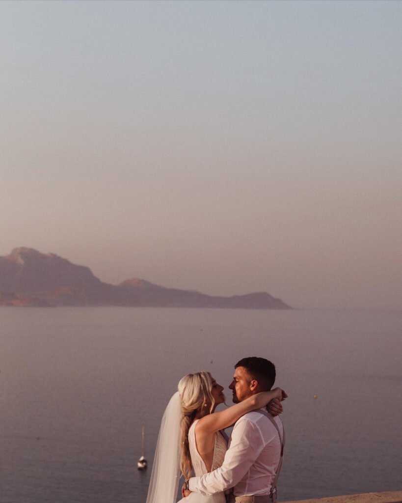 Bride and Groom kissing in sunset at Ktima Lindos 