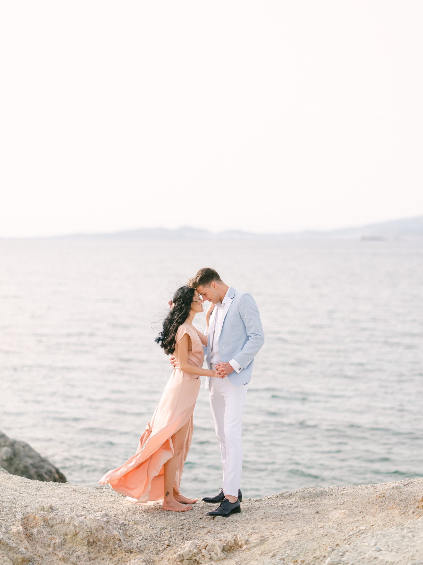 Escape to the Athenian Riviera couple strolls on the cliffs