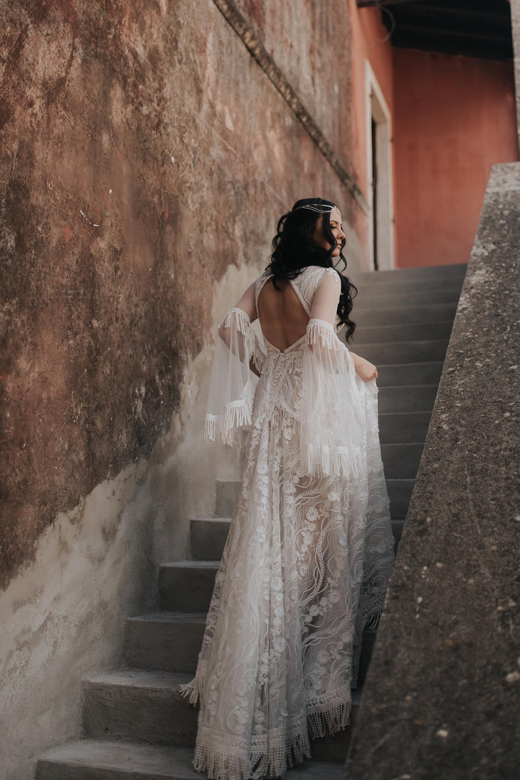 Bride walking up the stairs 
