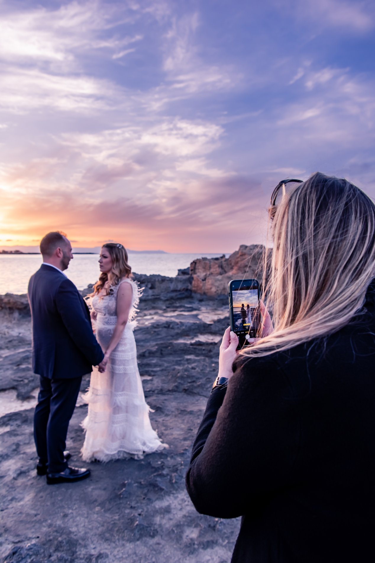 Wedding Content Creator working with a couple at a beach