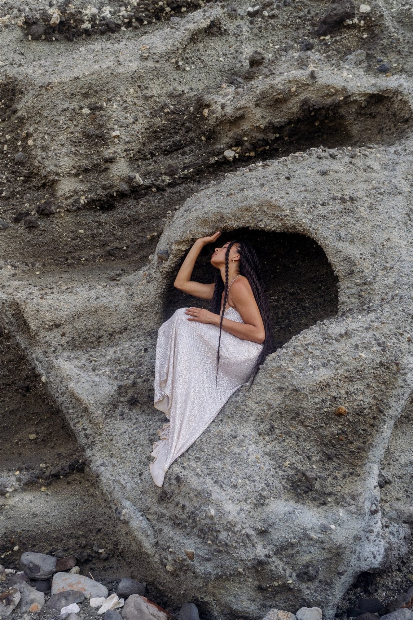 Celestial Elopement Inspiration Milos woman sitting in the cake like a mermaid in glittery dress