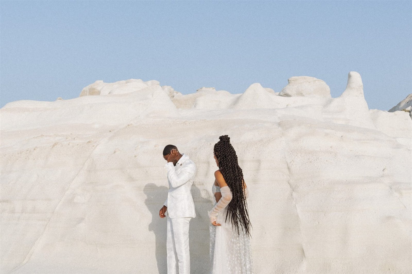 Celestial Elopement Inspiration Milos bride and groom the white rocks