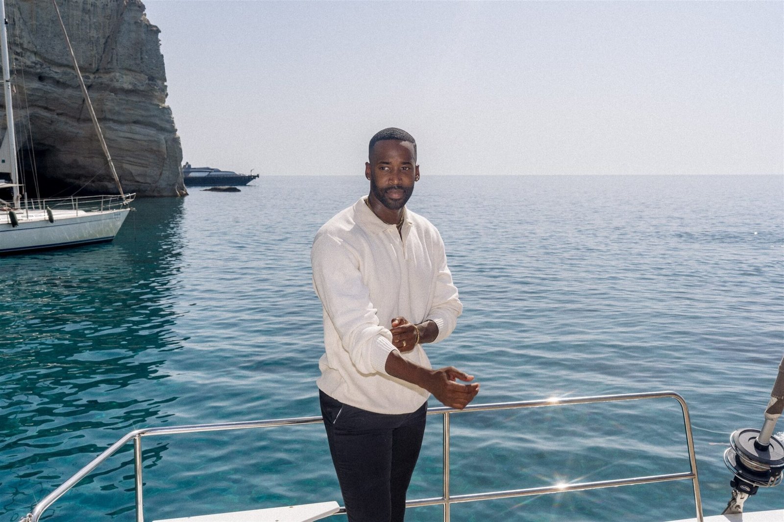 Celestial Elopement Inspiration Milos man on the Catamaran