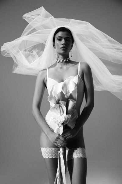 The FALKE Bridal Legwear x Kaviar Gauche bride with flower in the hand