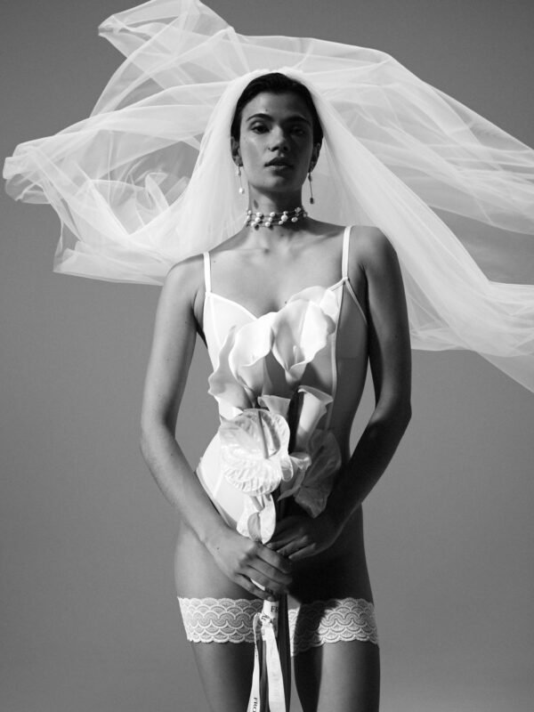 The FALKE Bridal Legwear x Kaviar Gauche bride with flower in the hand