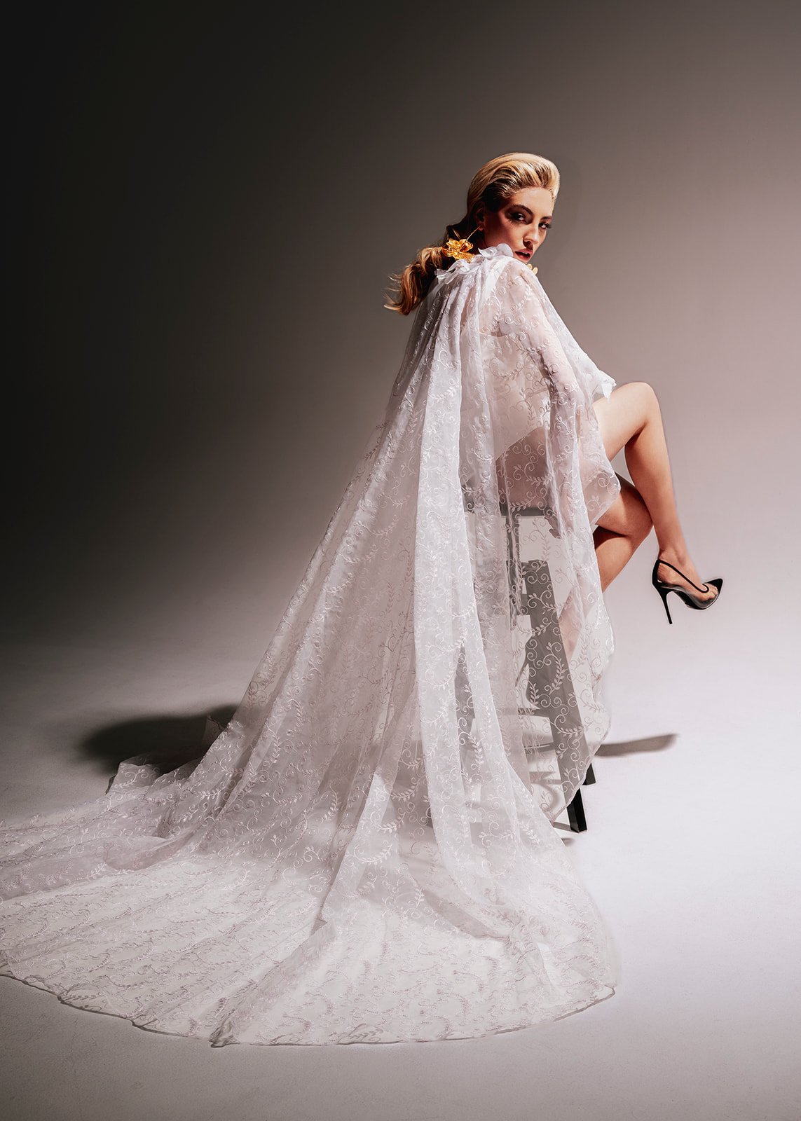 wedding dress appointment bride on the chair in the studio