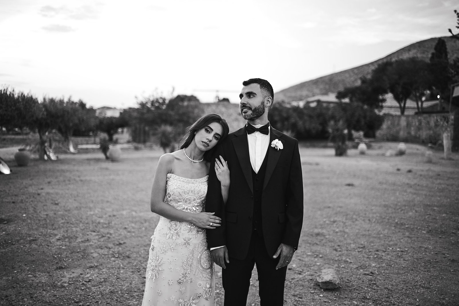 Bride and Groom holding hands in black and white photo