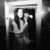 Black and white photo with flash of a couple in love exiting the elevator in their wedding resort hotel venue in Athens Greece