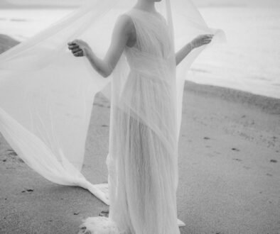 Destination Elopement in Rethymno, Crete, black and white image of a bride with veil on the beach