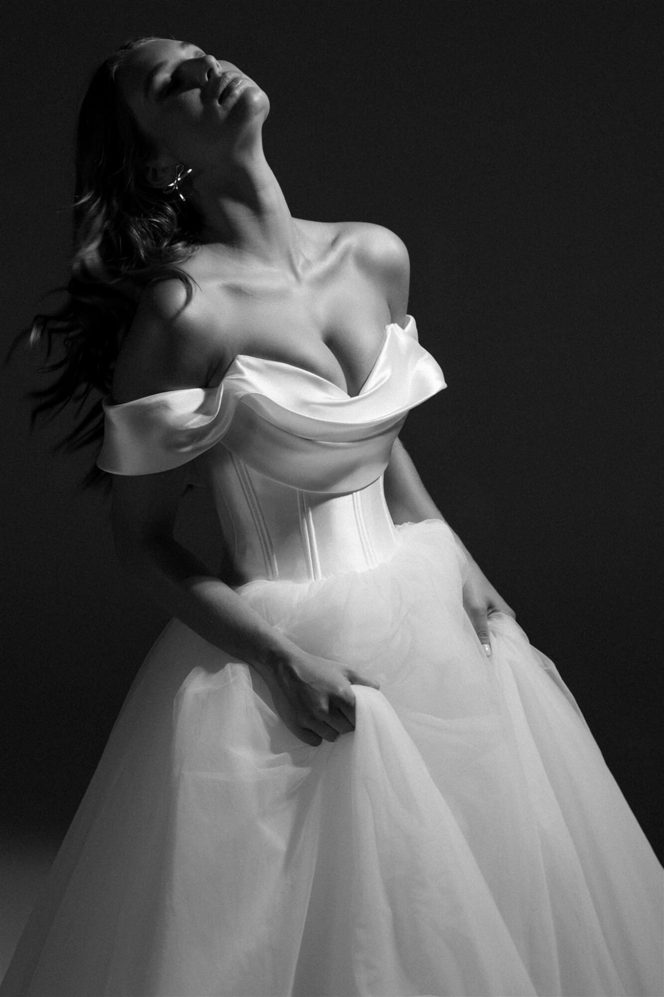 Hera Couture Bridal Collection Serene Echoes flowing tulle wedding gown on Santorini cliff with Aegean backdrop